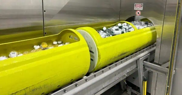 Drink bottles in an HPP vessel on a production line.